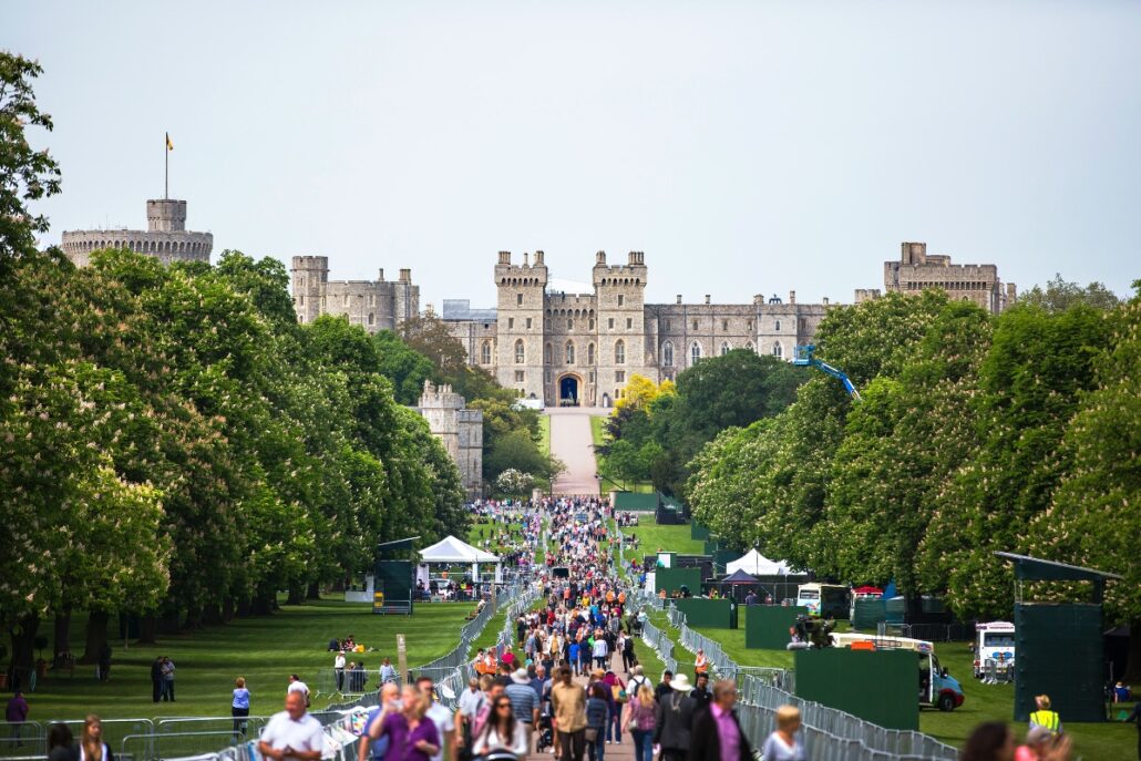 British castle with people parading in