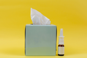 tissue box and nasal spray signify allergies and depression