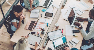 people collaborating at desk