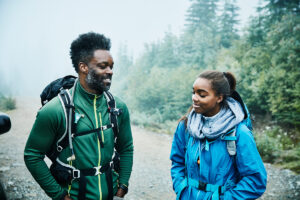 father and daughter stopped to talk on hike
