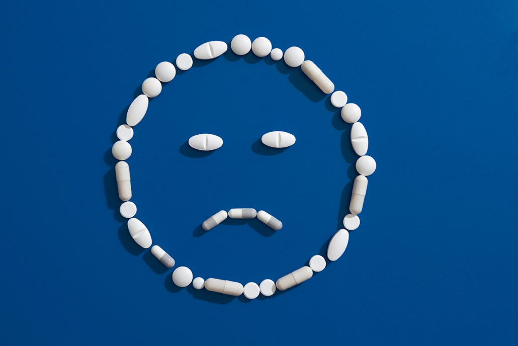 pills forming sad face