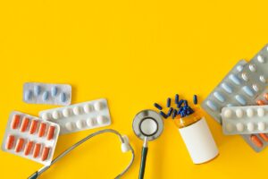 various pills and stethoscope