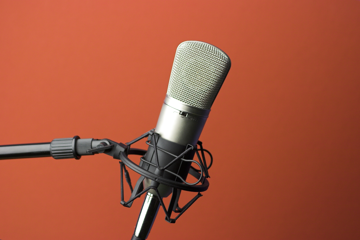 radio microphone in front of auburn background