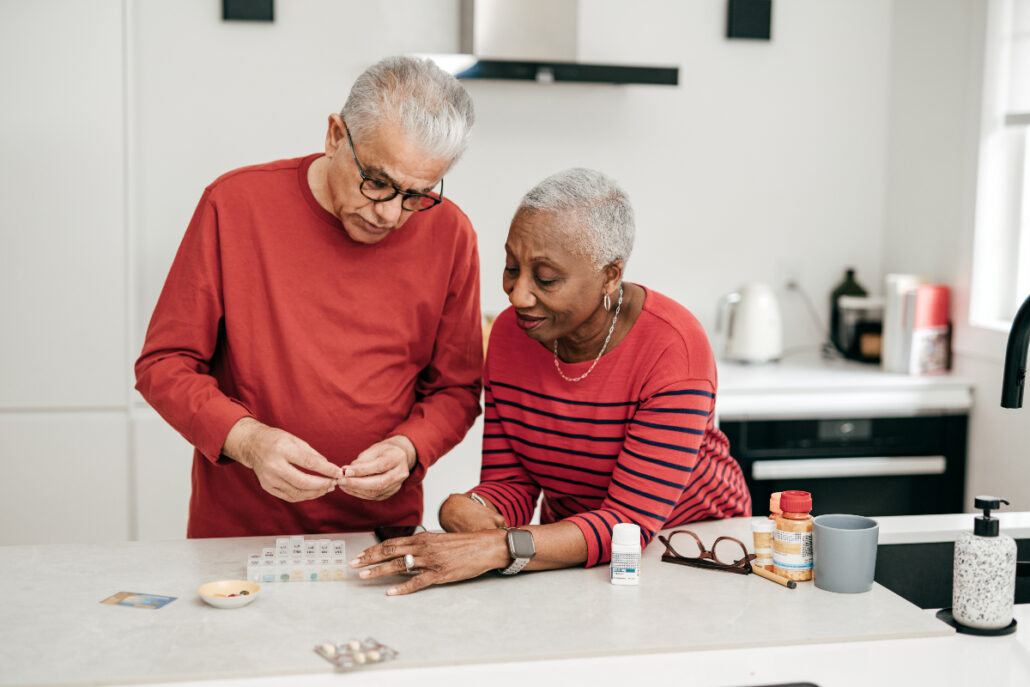 couple organizing their medications for medication adherence