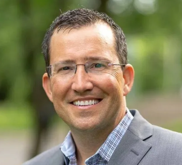 headshot of Adam Barese president of Genomind